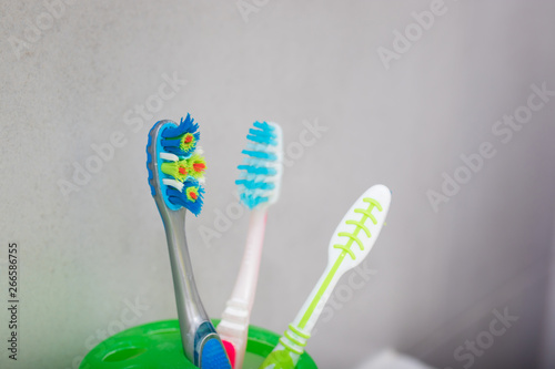 toothbrushes in the glass
