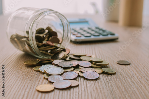 savings concepts with pot and coins