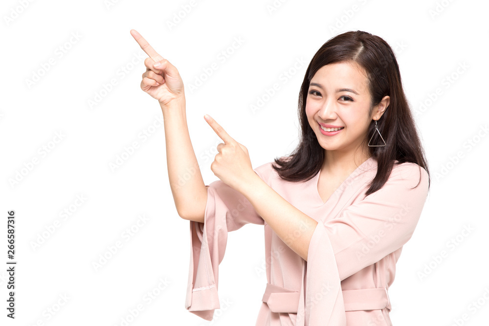 Young elegant Asian woman smiling and pointing to empty copy space isolated on white background Young elegant Asian woman smiling and pointing to empty copy space isolated on white background