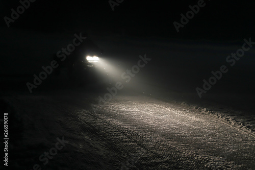 Night skiing. Snowy trails in the mountains. Illumination of the route © Yaroslav