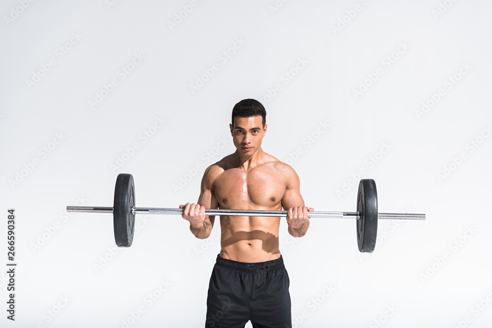 handsome athletic mixed race with muscular torso training with barbell on white handsome athletic mixed race with muscular torso training with barbell on white