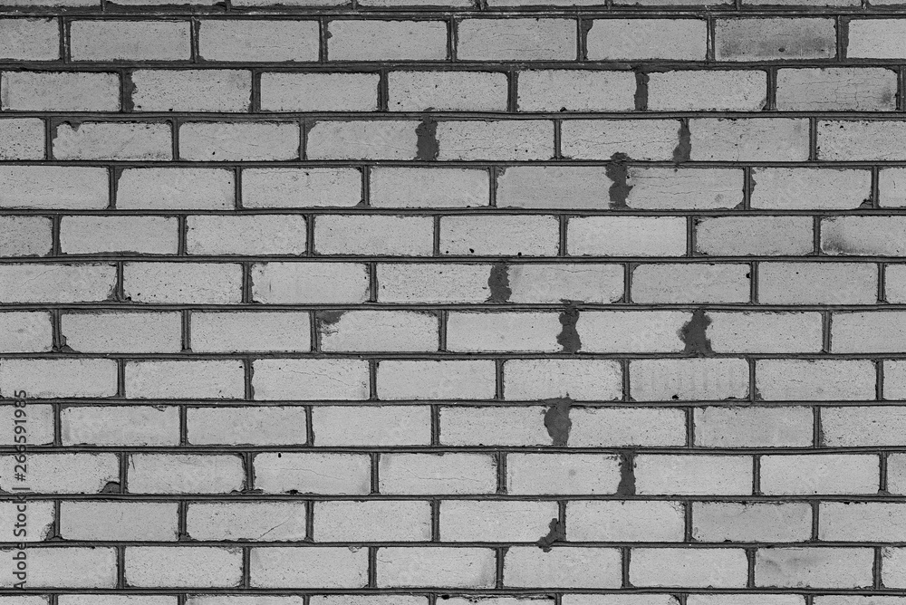 Texture, brick, wall, it can be used as a background . Brick texture with scratches and cracks