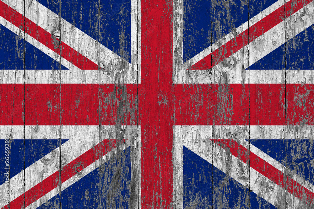 Fototapeta premium Flag of United Kingdom painted on worn out wooden texture background.