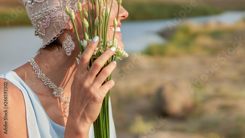  Beautiful bride in blue dress with simple elegant bouquet