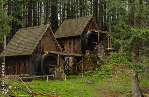 Wooden old mill in forest in valley near Zlate Hory town