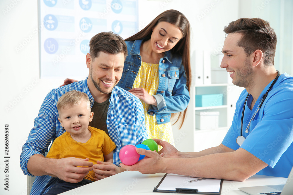 Family with child visiting doctor in hospital