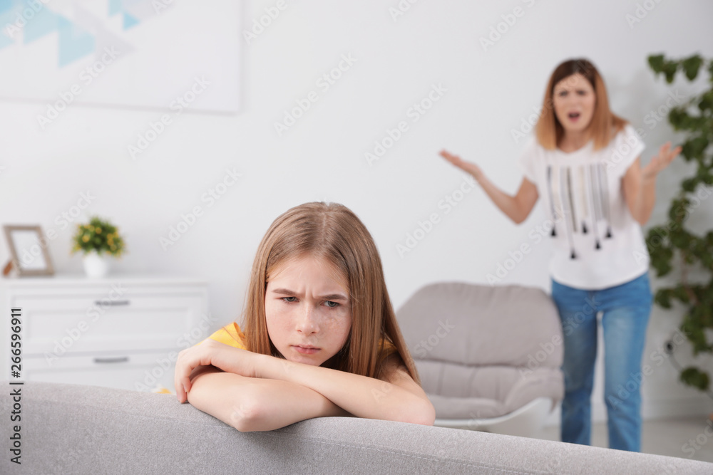 Mother scolding her teenager daughter at home Mother scolding her teenager daughter at home