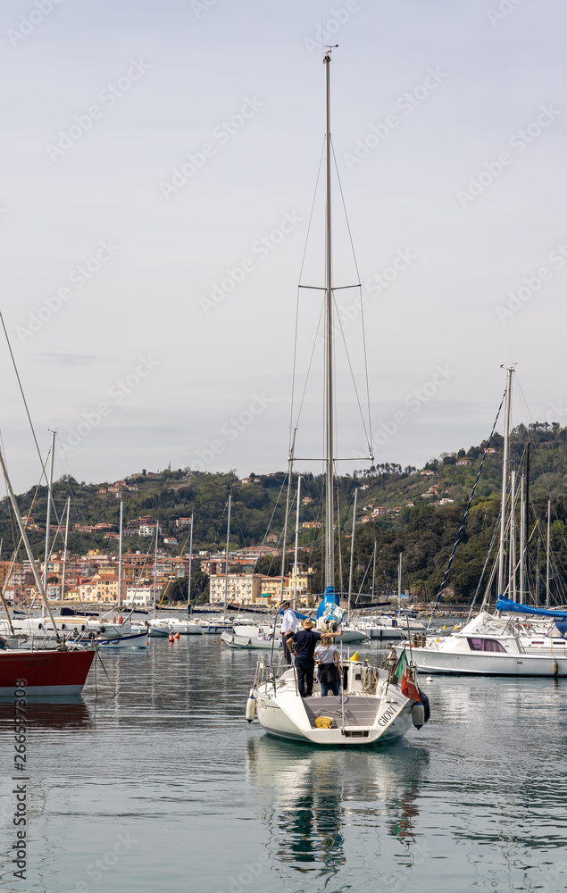 LERICI, LIGURIA/ITALY  - APRIL 21 : Boats in the harbour in Lerici in Liguria Italy on April 21, 2019. Three unidentified people