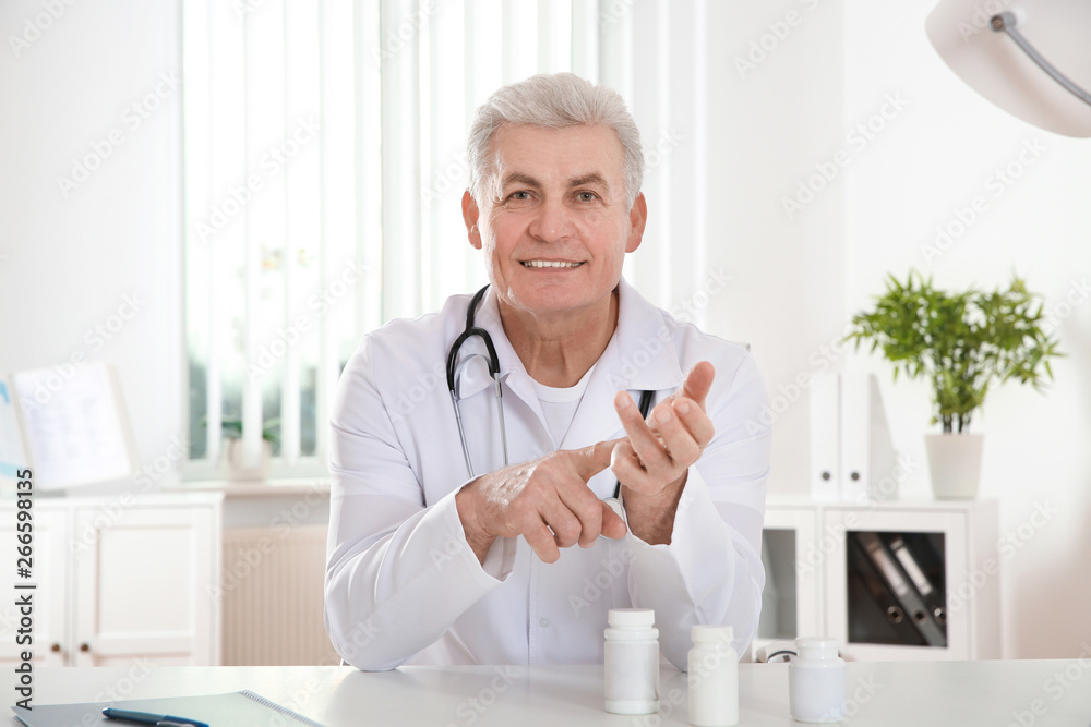 Doctor consulting patient using video chat in clinic, view from web camera Doctor consulting patient using video chat in clinic, view from web camera