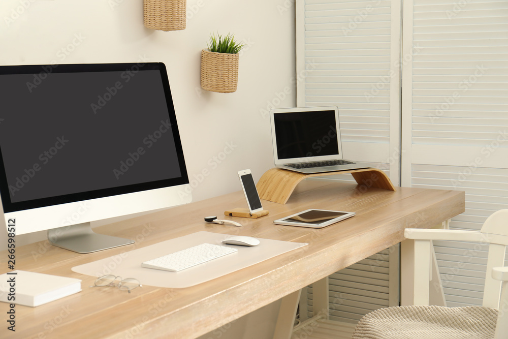 Stylish workplace interior with modern computer on table. Mockup for design Stylish workplace interior with modern computer on table. Mockup for design
