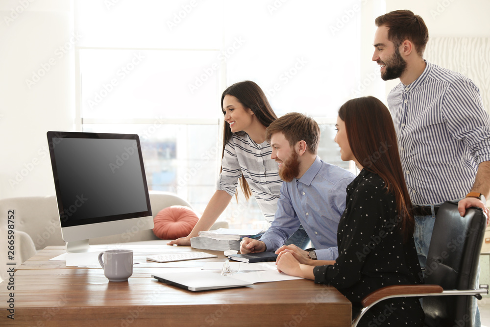 Group of colleagues using video chat on computer in office. Space for text