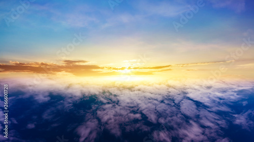Beautiful sunset . Beautiful heavenly landscape with the sun in the clouds . View of clouds from high altitude . Paradise heaven .light about the sky .