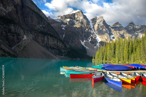 Canoes on lake in mountains