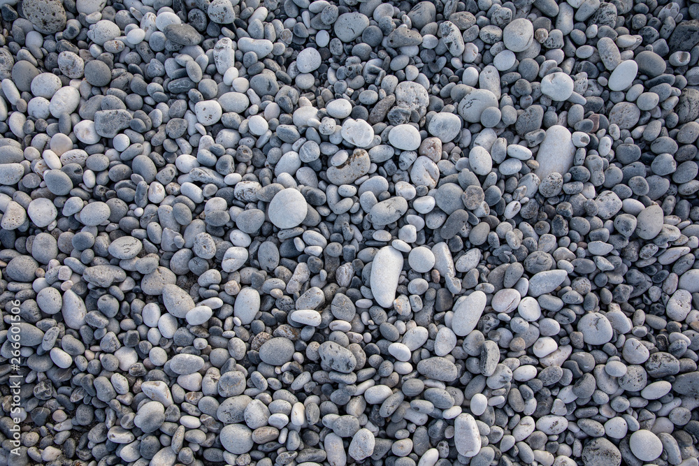 Light gray pebbles of the beach in the Kiparissi Lakonia village, Peloponnese, Zorakas Bay, Greece. Light gray pebbles of the beach in the Kiparissi Lakonia village, Peloponnese, Zorakas Bay, Greece.