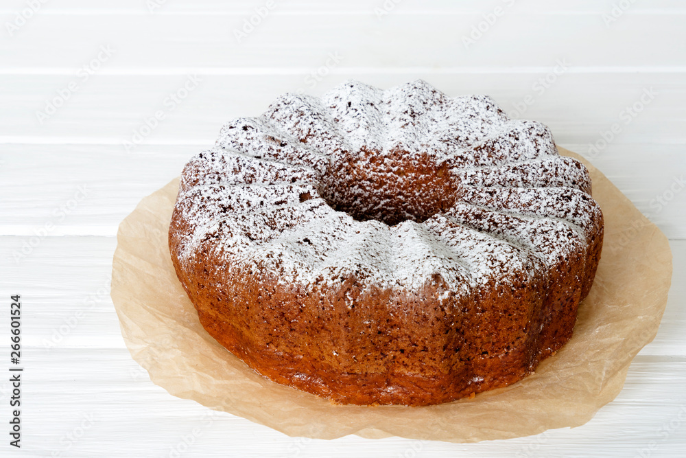 Homemade vanilla bunt cake on white wooden desk. Homemade vanilla bunt cake on white wooden desk.