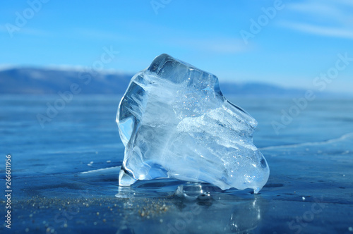 the sun s rays are refracted in crystal clear pieces of ice. winter landscape. Lake Baikal