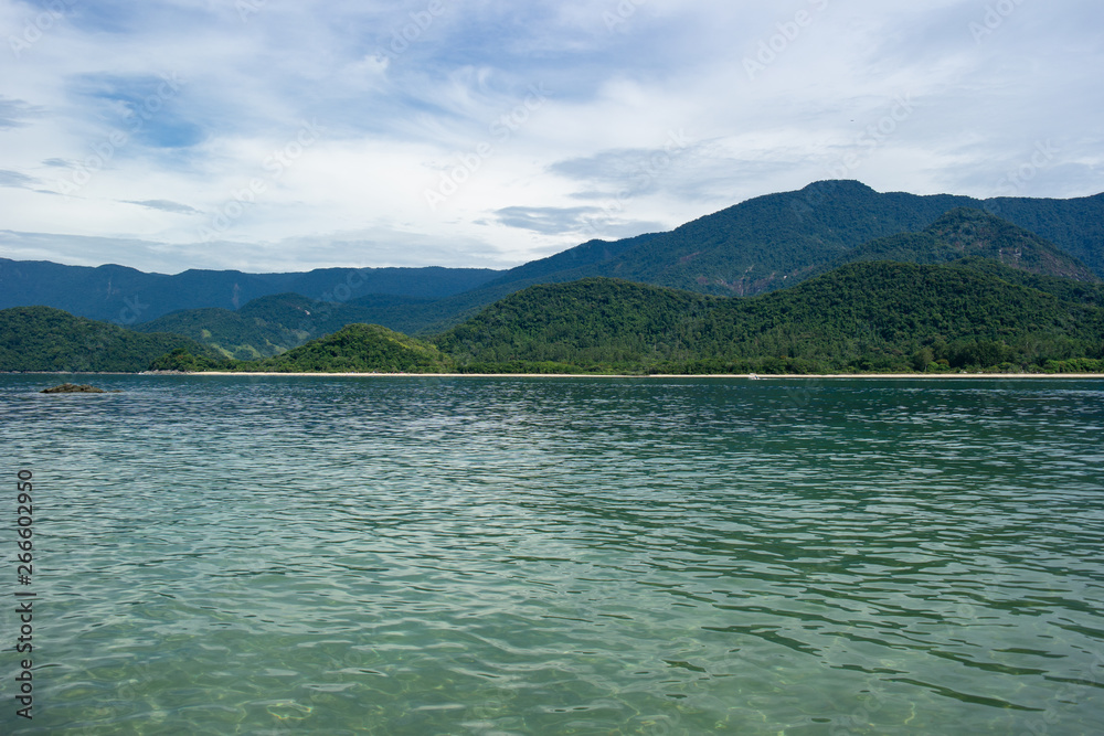 Calm sea and green mountains Calm sea and green mountains