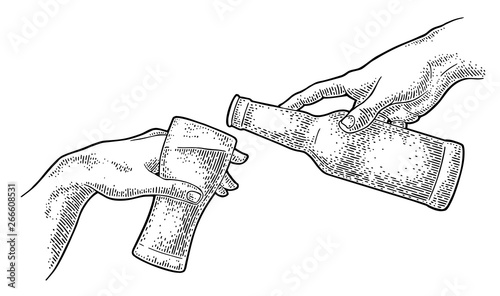 Male finger pouring beer from bottle into glass. The Creation of Adam.