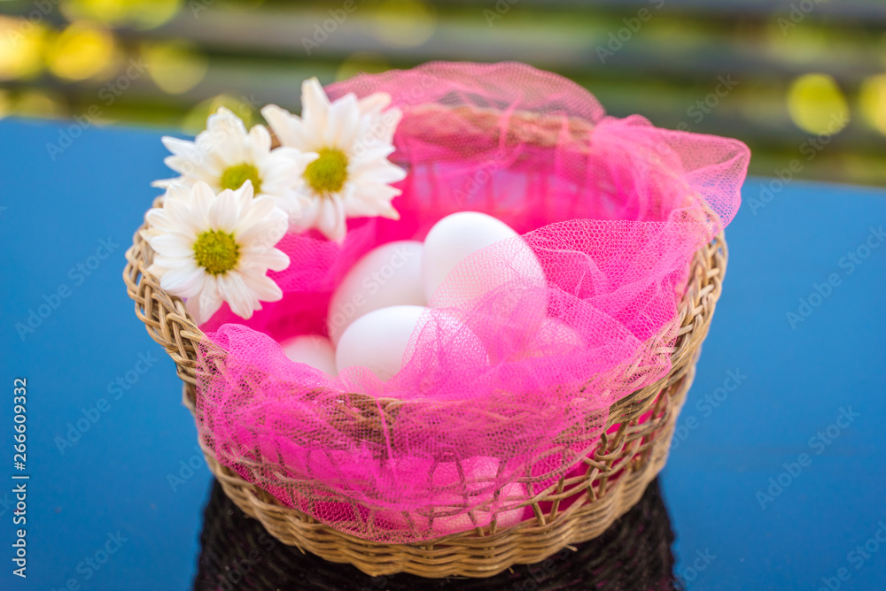 Easter eggs in a festive basket Easter eggs in a festive basket