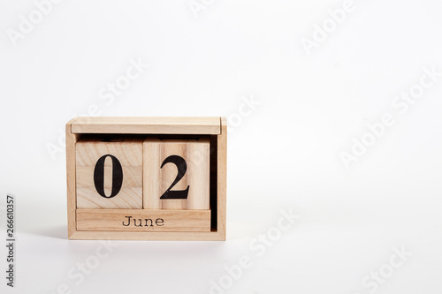 Wooden calendar June 02 on a white background