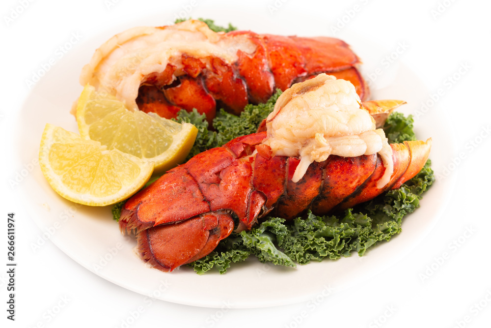Broiled Lobster Tails on a Bed of Kale with Lemon Slices