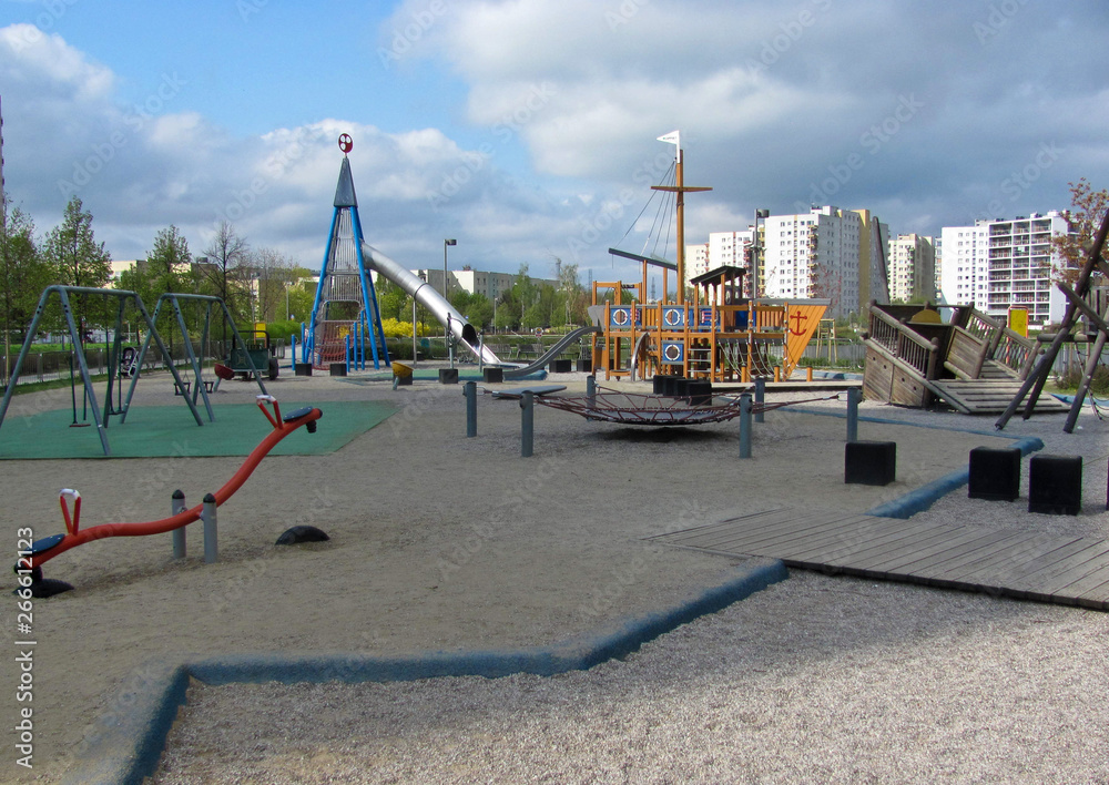 Children playground on yard in public park. Urban neighborhood childhood concept. Children playground on yard in public park. Urban neighborhood childhood concept.