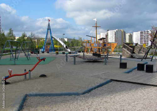 Children playground on yard in public park. Urban neighborhood childhood concept.