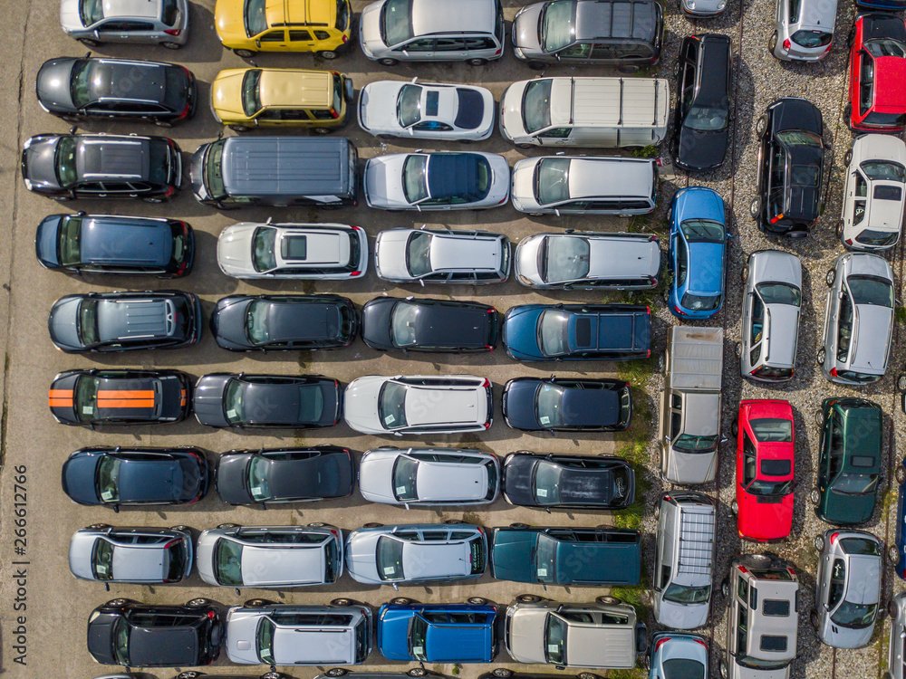 Aerial view of large car parking of car dealer. Secondhand cars.