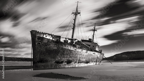 Huge aground boat on the beach