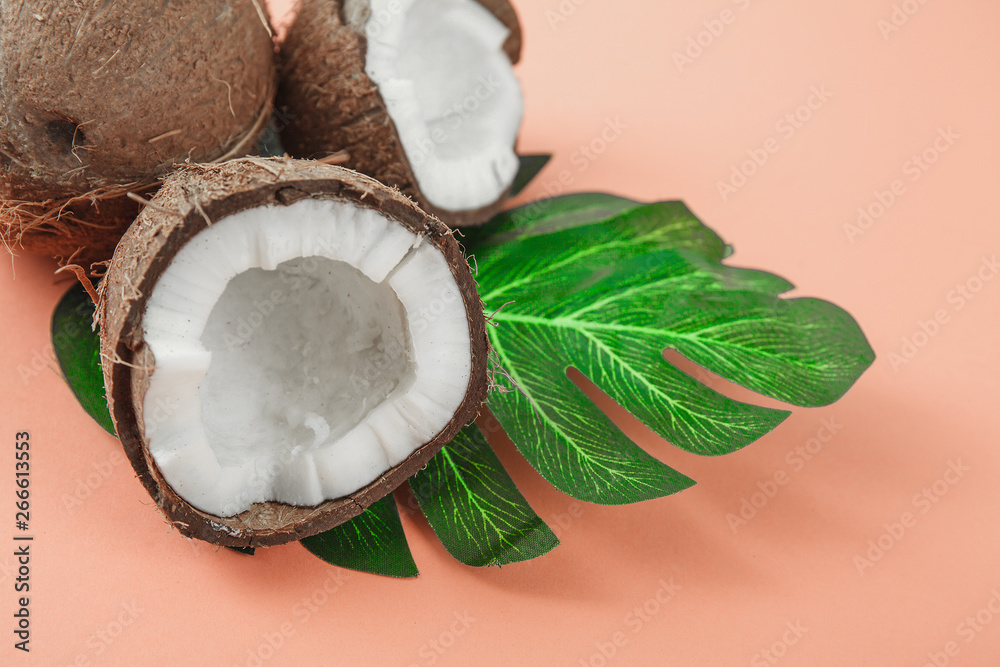 Fresh coconut on coral background Fresh coconut on coral background