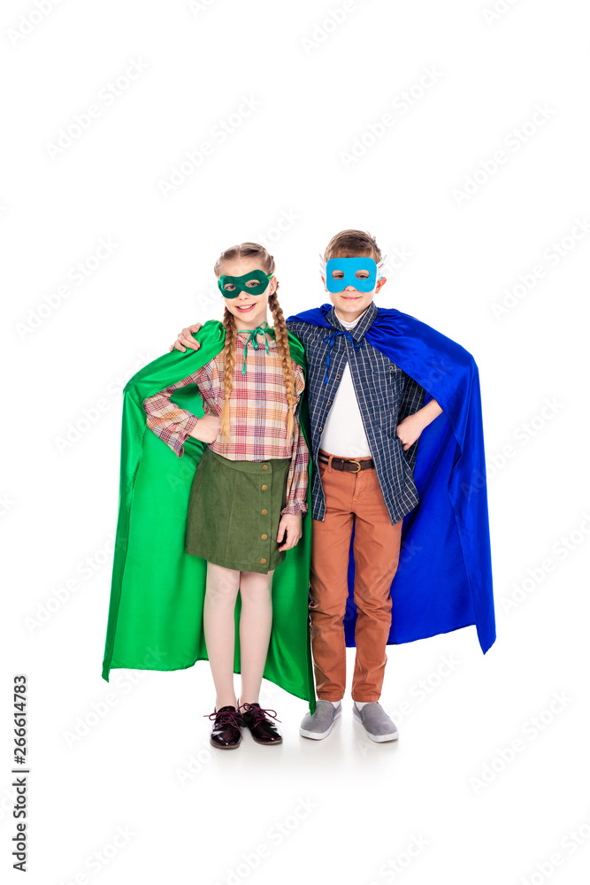 kids in superhero costumes and masks with Hands On Hips On White