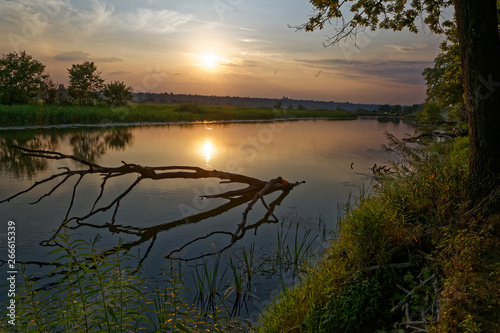 Colorful sunset over the river suburban area of central Russia.