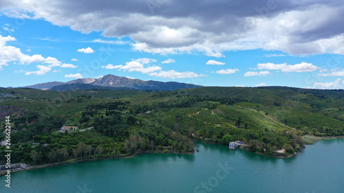 Aerial drone panoramic view of famous dam and lake of Marathon with beautiful clouds, North Attica, Greece