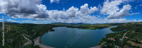 Aerial drone panoramic view of famous dam and lake of Marathon with beautiful clouds  North Attica  Greece