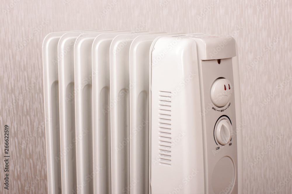 Oil-filled electrical radiator for additional home heating