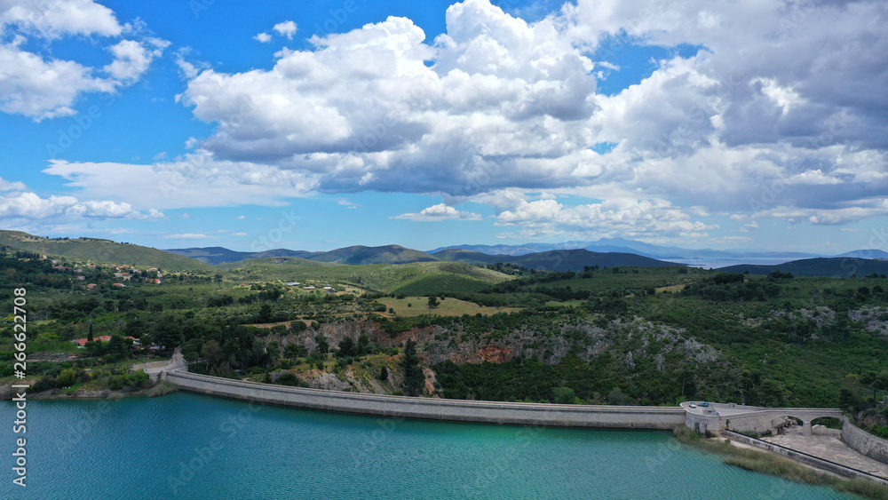 Aerial drone panoramic view of famous dam and lake of Marathon with beautiful clouds, North Attica, Greece