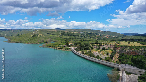 Aerial drone panoramic view of famous dam and lake of Marathon with beautiful clouds, North Attica, Greece
