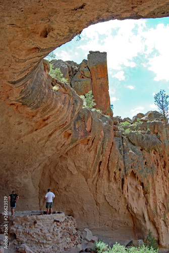 Hikers explore ancient Native American cliff dwellings, New Mexico