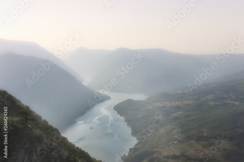 Popular lookout called Banjska stena  (Spa rock) on Tara national park, during a misty day, meandering Perucac lake and river Drina photo