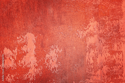 Uneven texture, with stains and smudges. Old wall painted red orange. Empty abstract background for layouts.