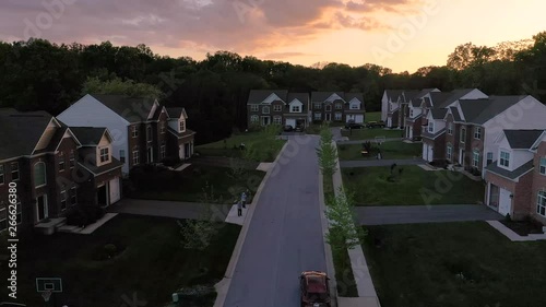 Aerial panorama of upper middle class single family houses real estate in a new construction in Maryland during sunset