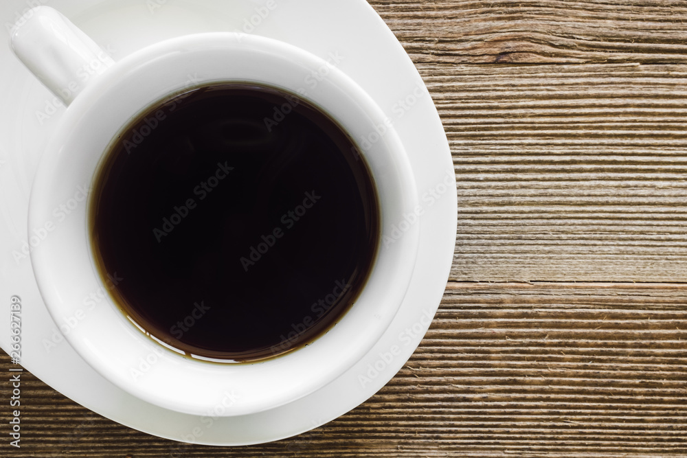 White Cup of Coffee on Rustic Background White Cup of Coffee on Rustic Background