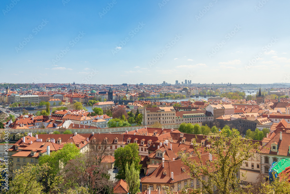 Outdoor sunny aerial top panoramic view of Prague historical old town skyline and  famous landmark Charles Bridge cross Vltava river from observation deck near Prague Castle in Prague, Czech Republic.