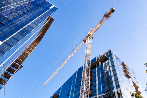 Crane and skyscrapers under construction in San Jose, South San Francisco bay area