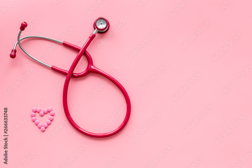 diagnostic and cure of heart disease with stethoscope and female symbol on pink background top view mock-up diagnostic and cure of heart disease with stethoscope and female symbol on pink background top view mock-up