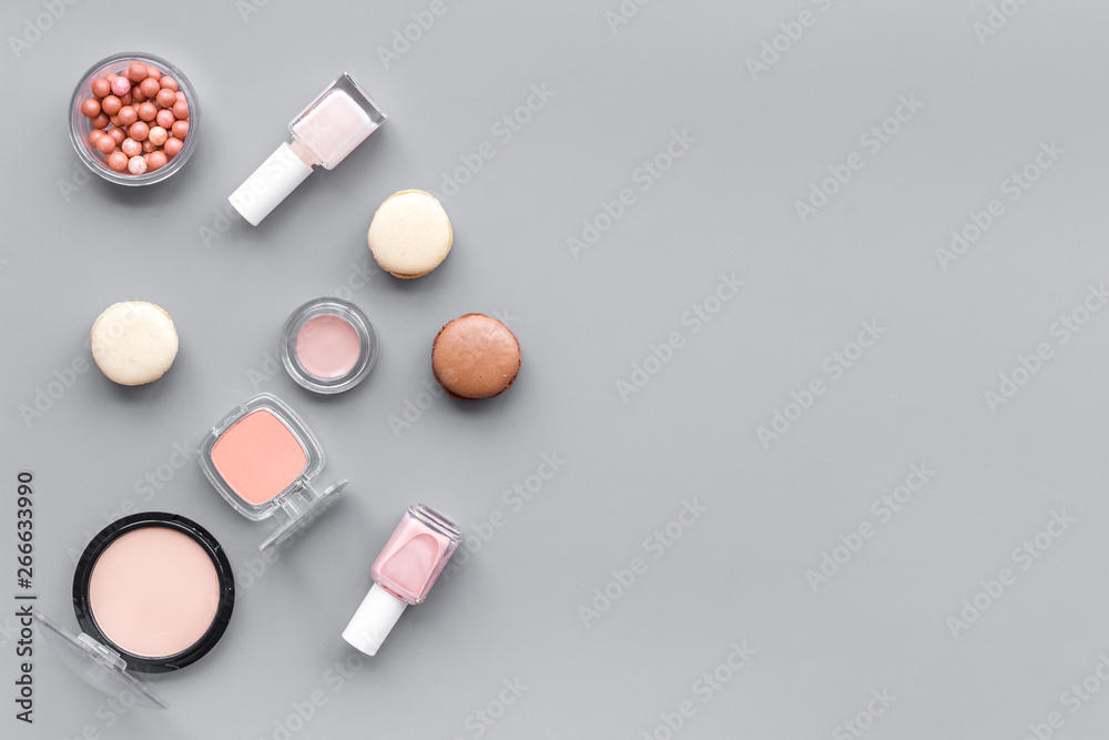 make-up accessories, fashion stylish cosmetics and macaroon on gray desk background top view copy space make-up accessories, fashion stylish cosmetics and macaroon on gray desk background top view copy space