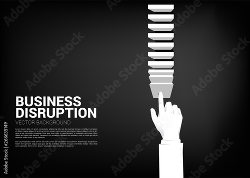 businessman hand pushing the block to create domino effect to hit the goal. business concept of making the domino effect to make disruption.