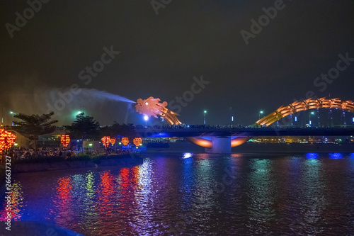 Dragon bridge in Da Nang, Vietnam, at night. The dragon blowing hot fire out of its mouth. A famous attraction in Da Nang.