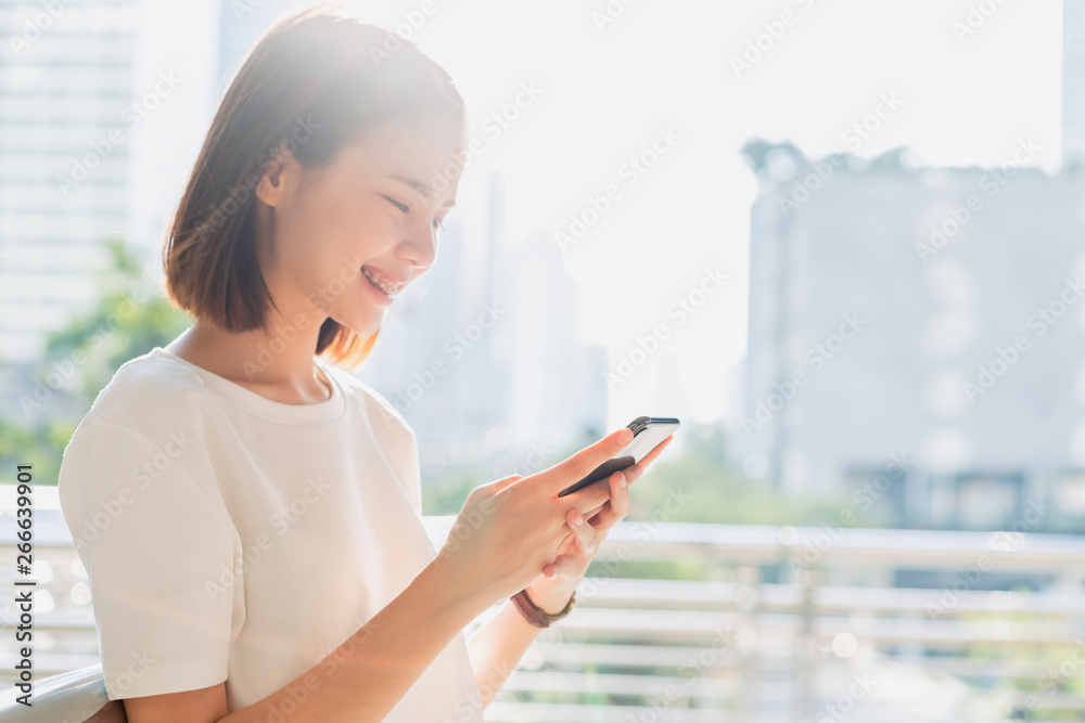 Woman using smartphone, During leisure time. The concept of using the phone is essential in everyday life. Woman using smartphone, During leisure time. The concept of using the phone is essential in everyday life.
