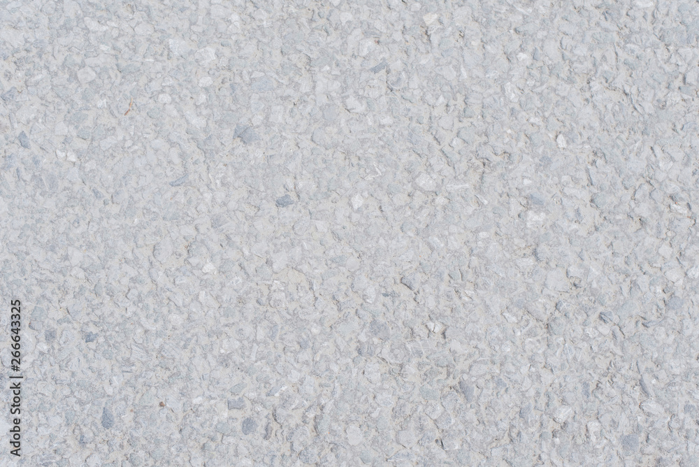 The texture of light asphalt. Stone gray background. Horizontal photo